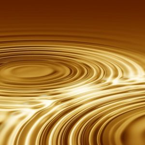 The golden waves of a waterdrop